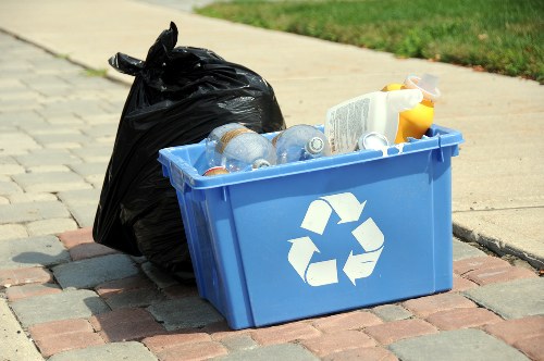 Workers sorting office waste for recycling in Coney Hall